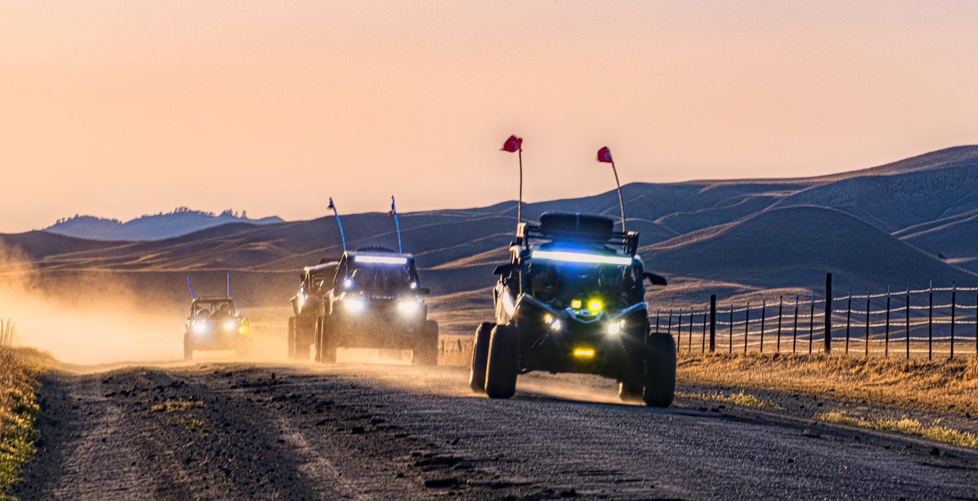UTVs barreling down a rural road