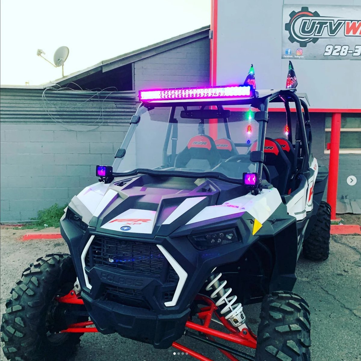 Modified UTV with neon pink accents