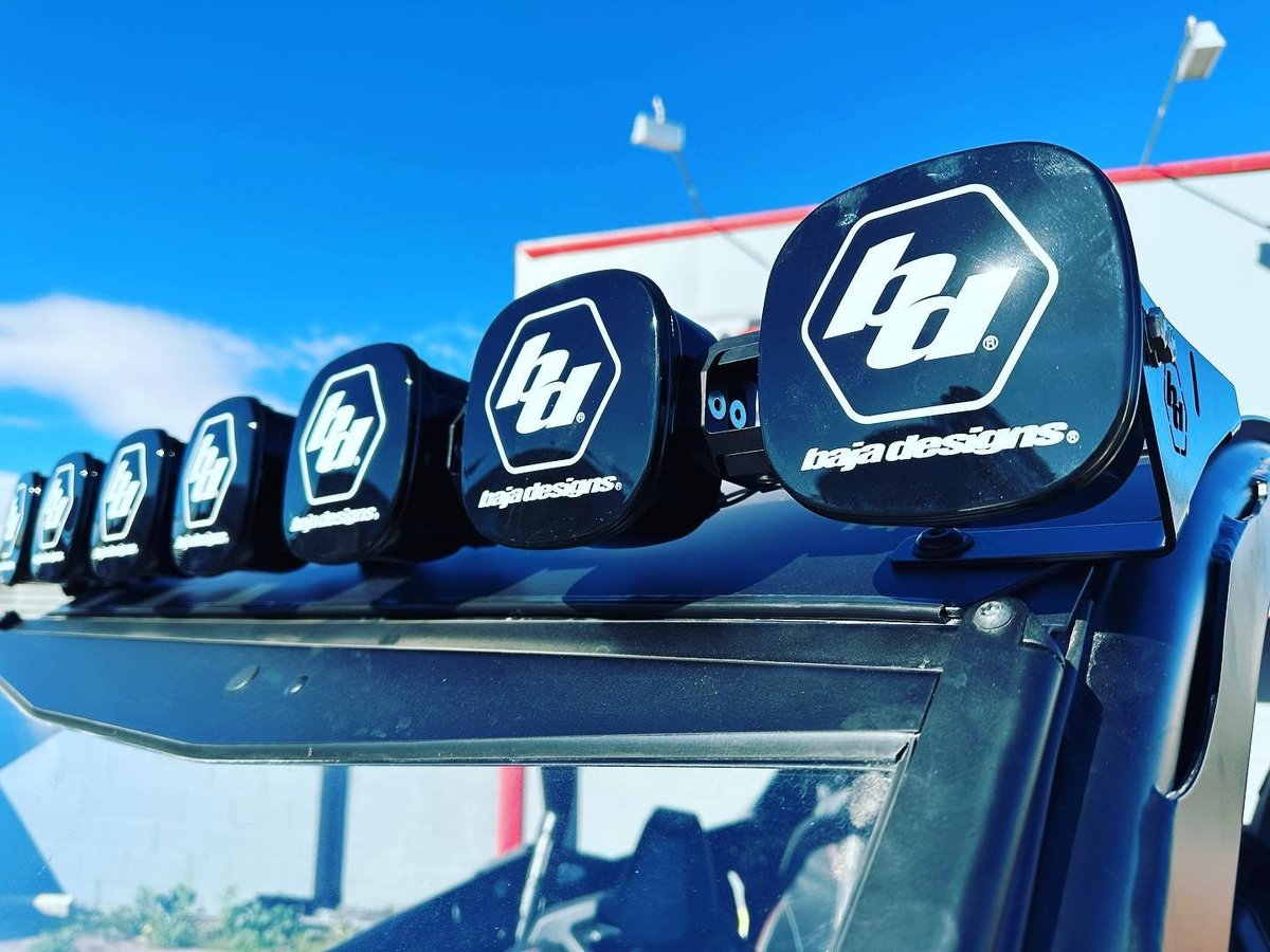 Row of blue trucks with roof racks