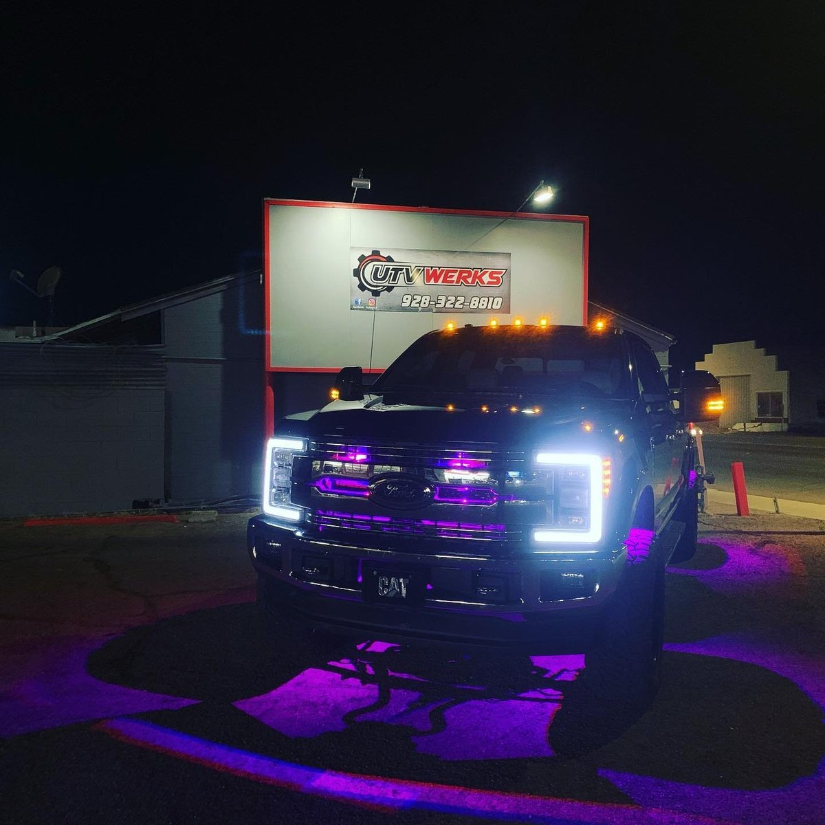 Purple and white truck with LED underglow