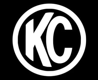 KC logo with white letters inside a circular border on black background